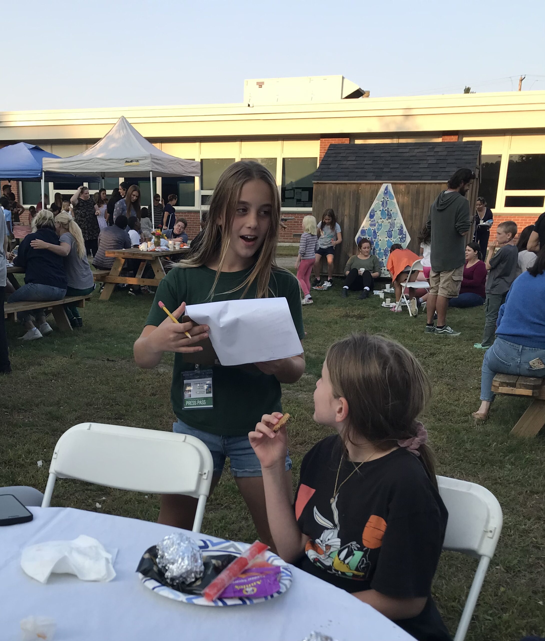 Corinne works as a Flynn School reporter, interviewing the guests at Open House (1)